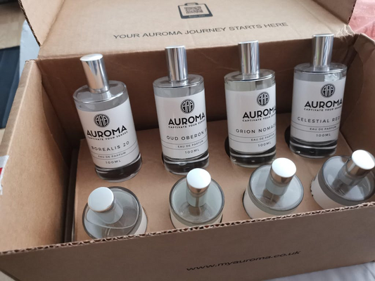 Set of Auroma diffuser bottles in a cardboard box